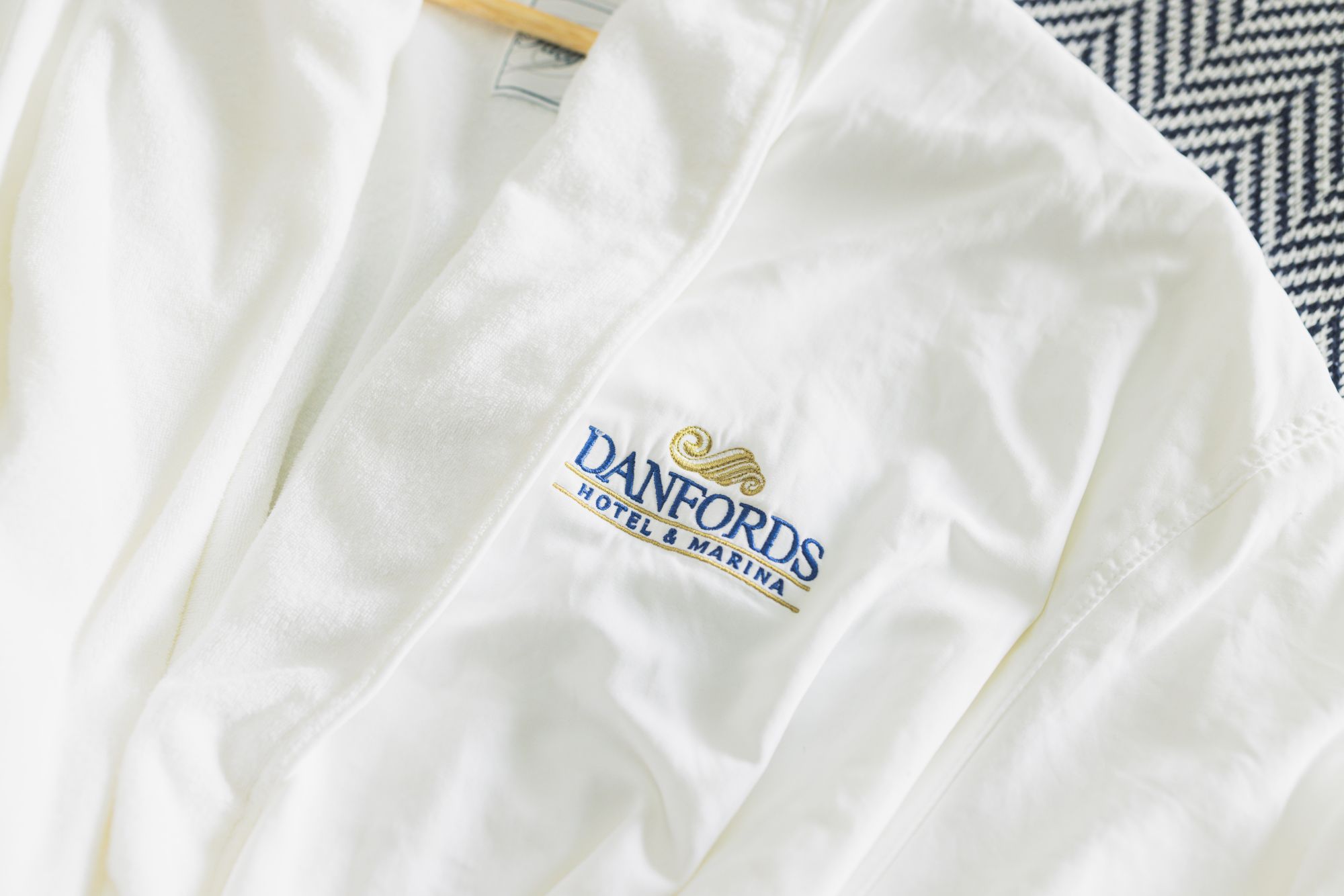 A white robe with the logo 