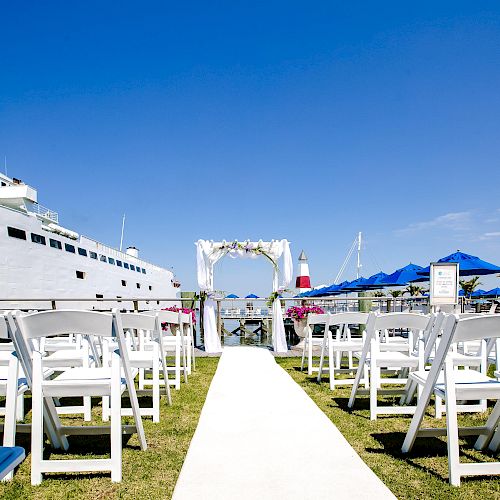 Laundry? No&mdash;it's a sunny seaside boardwalk with white railings, stairs, and blue sky; calm water in the background, vacation vibes.