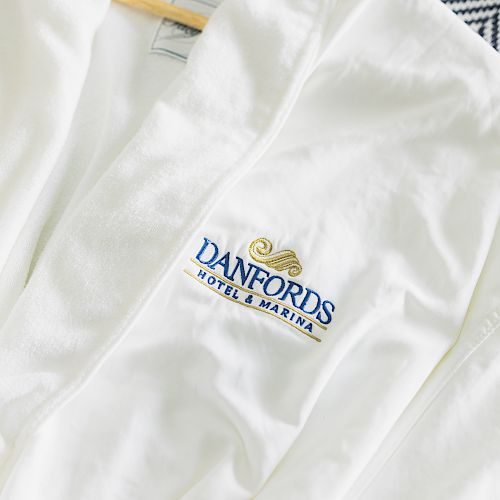 A white robe with the logo 